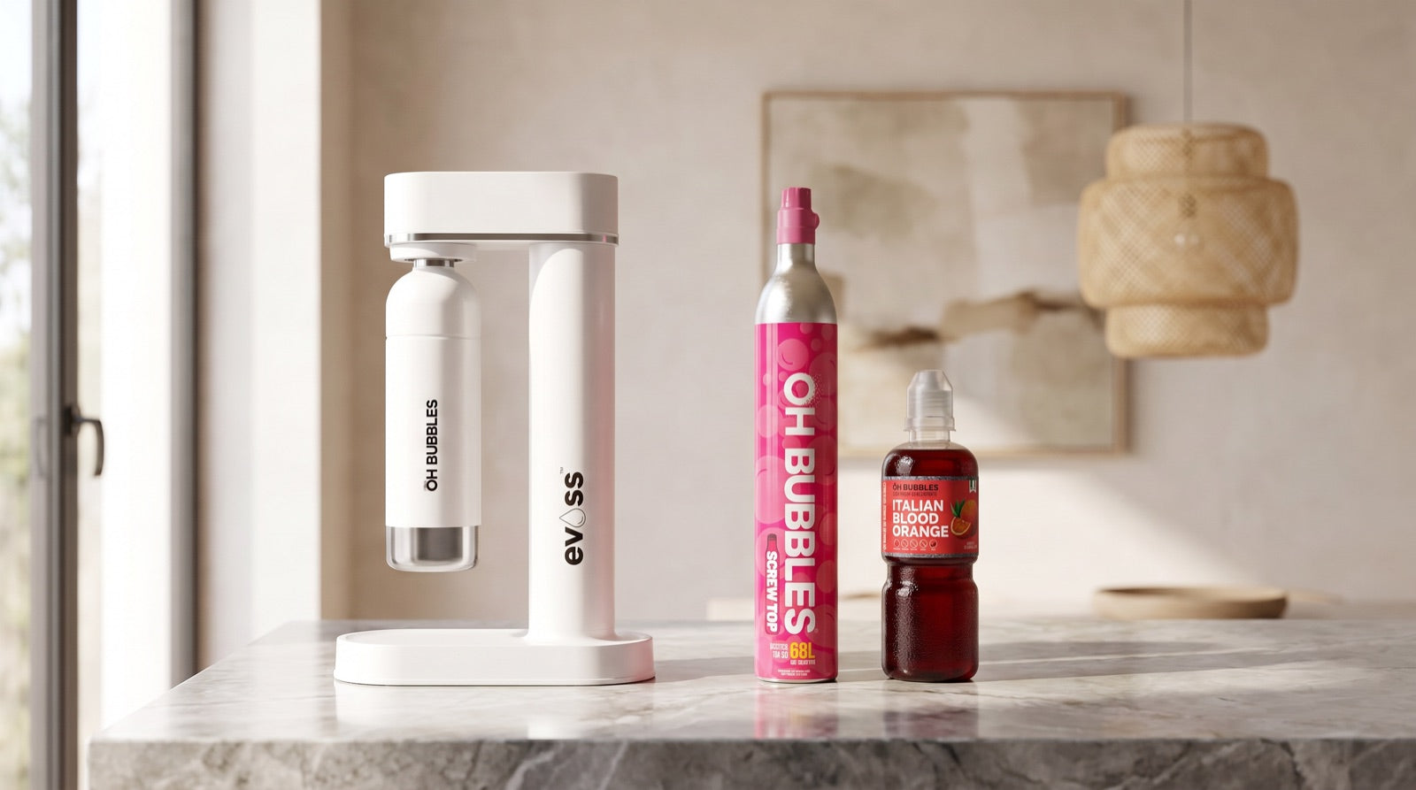 The white EVOSS soda maker on a stone kitchen bench with the OH Bubbles CO2 cylinder and Italian blood orange syrup beside it