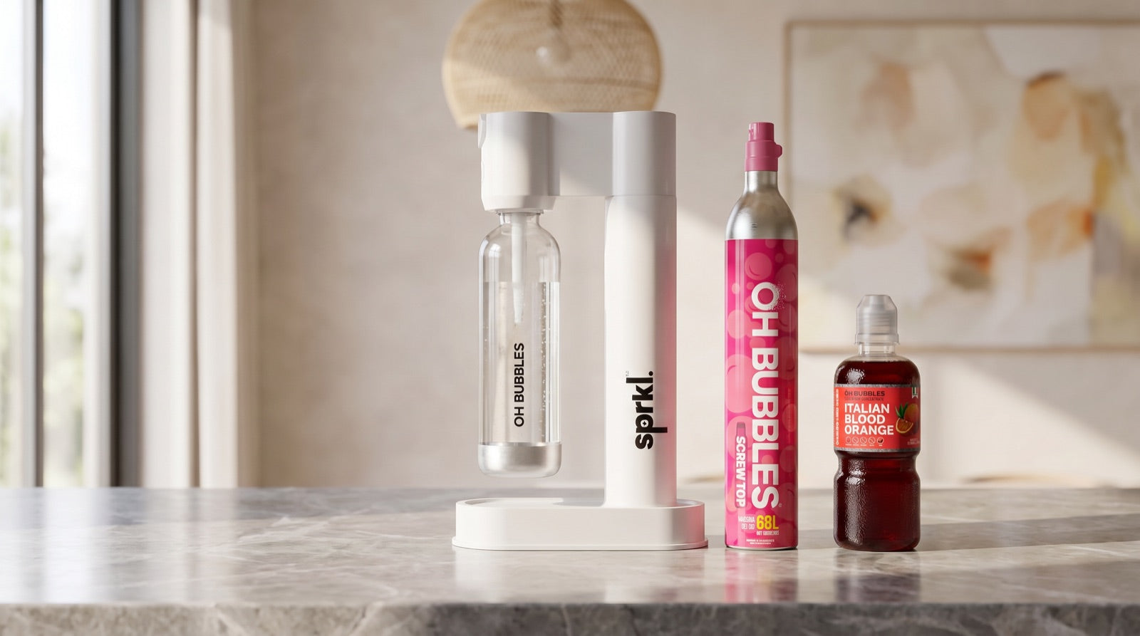 The white SPRKL soda maker on a stone kitchen bench with the OH Bubbles CO2 cylinder and Italian blood orange syrup beside it