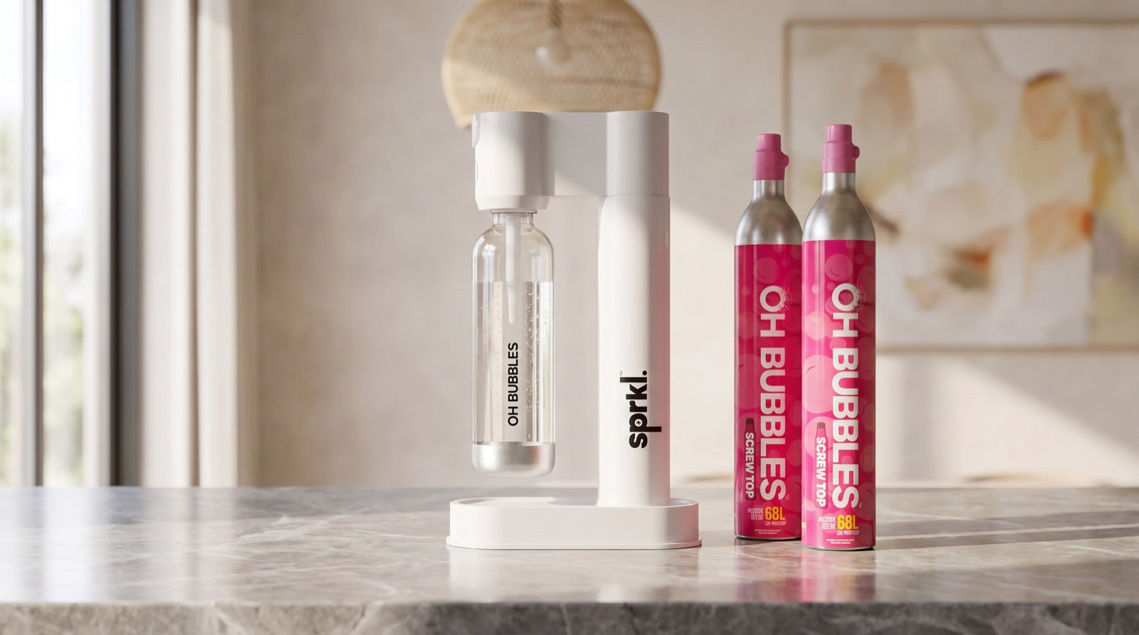 The white SPRKL soda maker on a stone kitchen bench with the OH Bubbles CO2 cylinder and Italian blood orange syrup beside it
