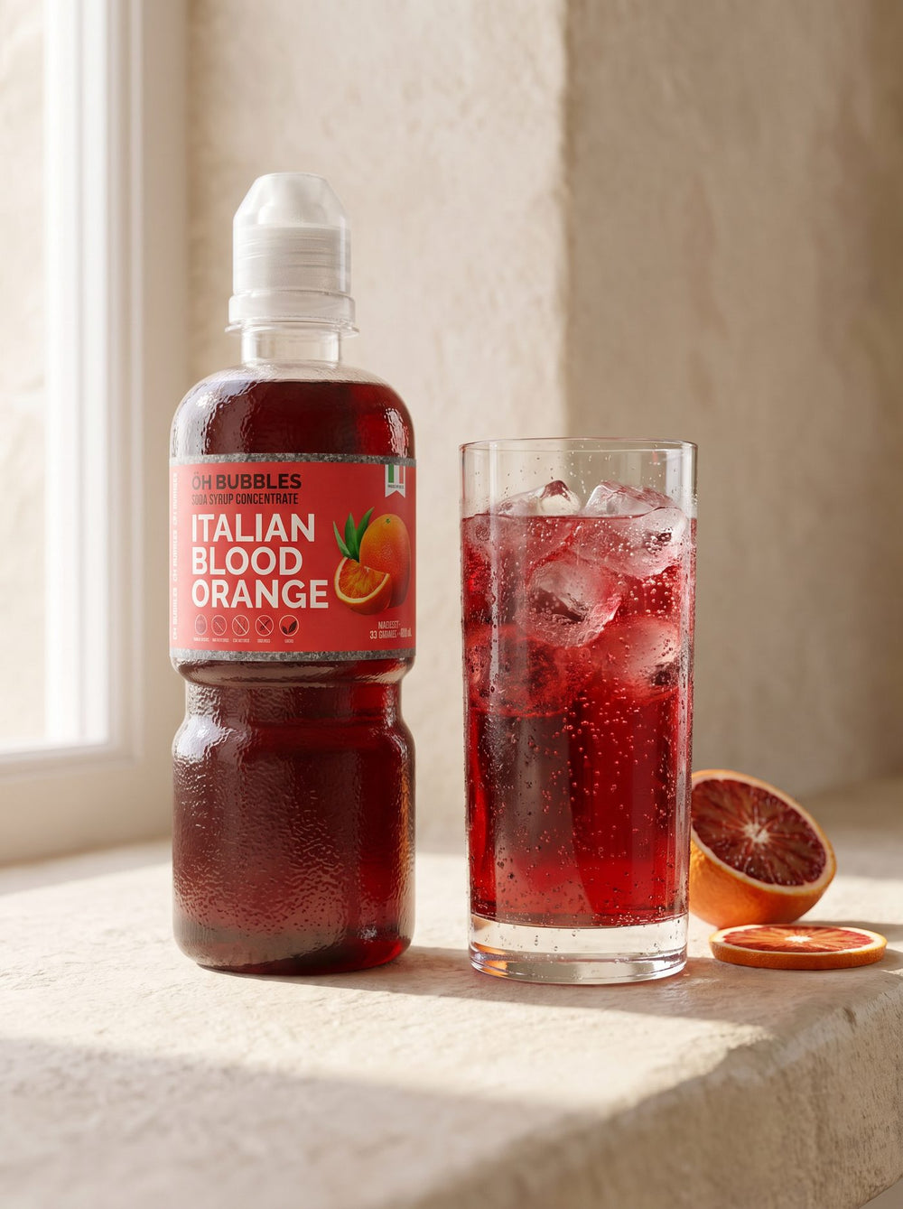 A finished Blood Orange Concentrated Syrup drink over ice, made with real fruit