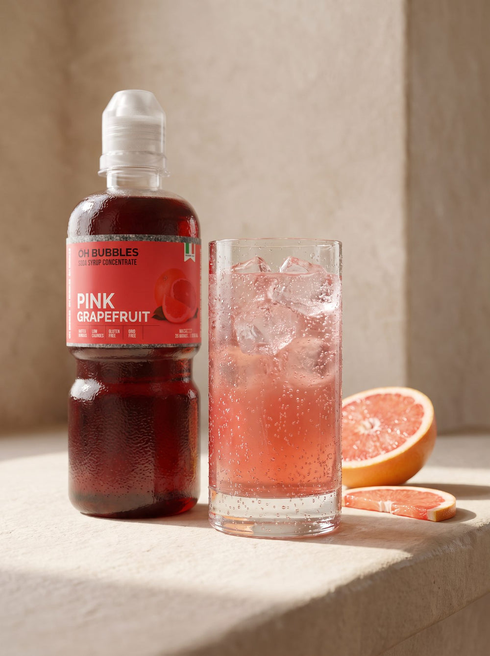 A finished Pink Grape Fruit Concentrated Syrup drink over ice, made with real fruit