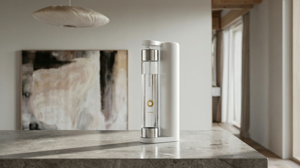 An OH Bubbles sparkling water maker on a stone kitchen bench