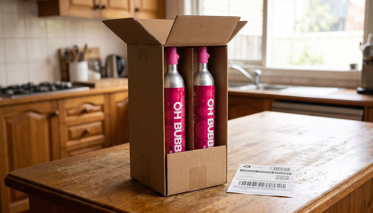 OH Bubbles cylinders in an open kraft box with the prepaid courier return label alongside