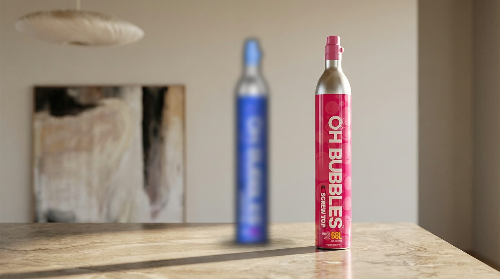 A blurred blue soda cylinder standing behind a full OH Bubbles cylinder on a stone kitchen bench